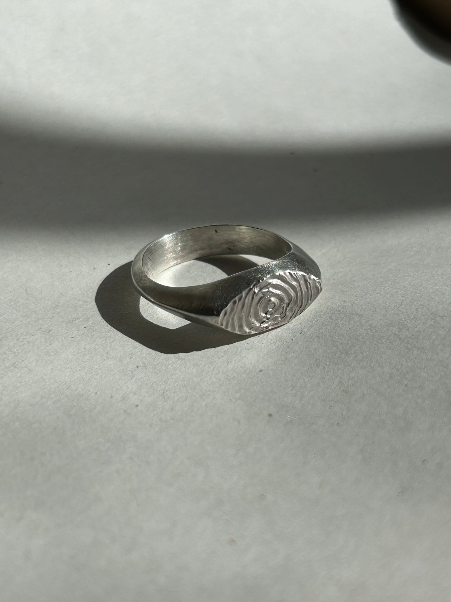 the smaller sketched swirl ring