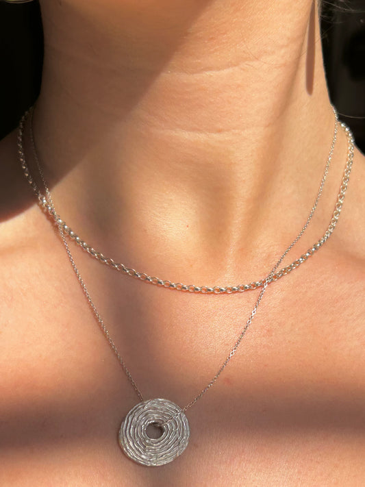 the sketched swirl necklace