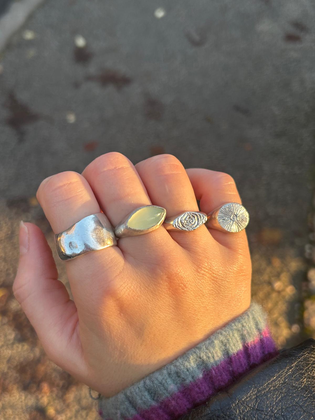 the textured sun signet ring